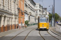 Hungary, Pest County, Budapest, tram on bank of the River Danube, Buda at approach to Chain Bridge.