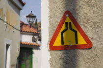 Greece, Northern Aegean, Samos Island, Vathy, Warning sign marking narrowing of street in old town.