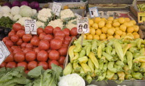 Greece, Attica, Athens, Central market, Display of fruit and vegetable summer produce on grocers stall, including lemons, tomatoes, cauliflower, lettuce and peppers.