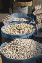 Greece, Attica, Athens, Central Market, Sacks of beans for sale on food stall.