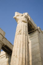 Greece, Attica, Athens, Acropolis Propylaea gate against clear blue summer sky from low viewpoint looking upwards.