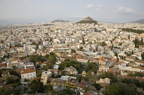 Greece, Attica, Athens, Mount Lycabettus rising in central Athens with densely populated city below.