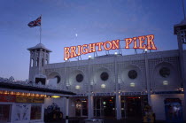 England, East Sussex, Brighton, Pier illuminated at night.