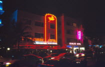 USA, Florida, Miami, South Beach, Ocean, Drive, Art Deco buildings illuminated at Night, Boulevard and Starlite hotels with neon signs.