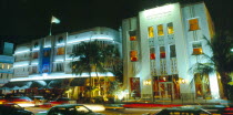 USA, Florida, Miami, South Beach, Ocean Drive, Exterior of the Cavalier and Cardozo hotels illuminated at night with neon lights.