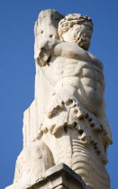 Greece, Athens, Ancient Agora, Giants statue, cropped view of classical male figure with muscled torso.