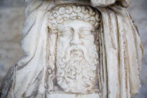 Greece, Athens, Carved, bearded head thought to be that of Zeus, King of the Gods, the ruler of Mount Olympus and the god of the sky and thunder in Greek mythology.