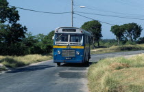 West, indies, Barbados, Local bus traveling along country road.