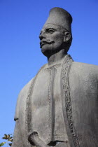 Albania, Tirana, Statue of male figure.