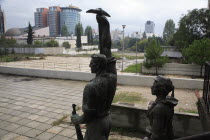 Albania, Tirana, Statue of communist worker holding pickaxe.