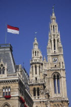 Austria, Vienna, Rathaus, detail of roof and towers with red and white flag flying.
