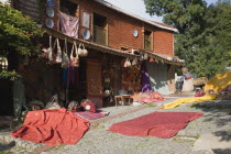 Turkey, Istanbul, Sultanahmet, Textiles and souvenirs displayed for sale next to Hagia Sophia.