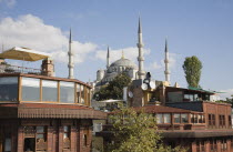 Turkey, Istanbul, Sultanahmet. Rooftop breakfast areas at boutique hotels with view to The Blue Mosque, also know as the Sultan Ahmed Mosque.