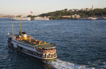 Turkey, Istanbul, Sultanahmet, Crowded Bosphorous passenger ferry at sunset.