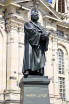 GERMANY, Saxony, Dresden, The restored Baroque church of Frauenkirch in Neumarkt with a statue of Martin Luther in the foreground.