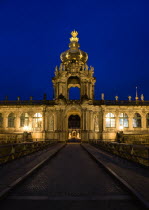 GERMANY, Saxony, Dresden, The Crown Gate or Kronentor of the restored Baroque Zwinger Palace illuminated at night originally built between 1710 and 1732 after a design by Matthus Daniel Pppelmann in...