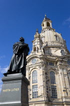 GERMANY, Saxony, Dresden, The restored Baroque church of Frauenkirch in Neumarkt with a statue of Martin Luther in the foreground.