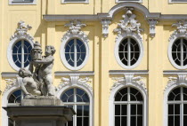 GERMANY, Saxony, Dresden, The Baroque courtyard entrance to the Coselpalais which is now a restuarant with cherubs on a plinth.