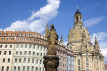 GERMANY, Saxony, Dresden, The restored Baroque church of Frauenkirch and surrounding restored buildings in Neumarkt with a statue in the foreground.