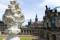 GERMANY, Saxony, Dresden, The central Courtyard of the restored Baroque Zwinger Palace gardens seen from the statue lined Rampart originally built between 1710 and 1732 after a design by Matthus Dani...