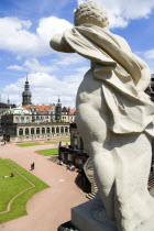 GERMANY, Saxony, Dresden, The central Courtyard of the restored Baroque Zwinger Palace gardens busy with tourists seen from the statue lined Rampart originally built between 1710 and 1732 after a desi...