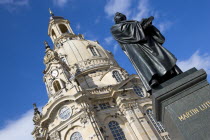 GERMANY, Saxony, Dresden, The restored Baroque church of Frauenkirch in Neumarkt with a statue of Martin Luther in the foreground.