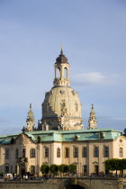 GERMANY, Saxony, Dresden, Late afternoon light on buildings on the Bruhl Terrace busy with tourists in front of the Frauenkirche Church of Our Lady Dome on the River Elbe.
