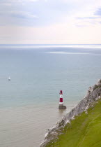 England, East Sussex, Eastbourne, Beachy Head, view of the lighthouse at the base of the chalk cliffs.