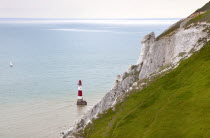England, East Sussex, Eastbourne, Beachy Head, view of the lighthouse at the base of the chalk cliffs.