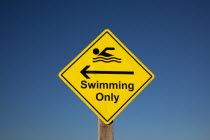 Signs, Warning, Swim area indicating stretch of beach suitable for safe swimming.