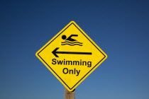 Signs, Warning, Swim area indicating stretch of beach suitable for safe swimming.