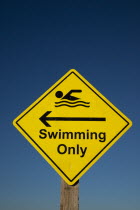 Signs, Warning, Swim area indicating stretch of beach suitable for safe swimming.