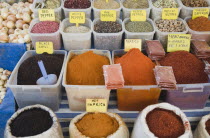 Turkey, Aydin Province, Kusadasi, Stall at weekly market selling spices and chili powders in brightly coloured display.