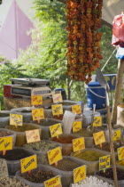 Turkey, Aydin Province, Kusadasi, Stall at weekly market selling spices and chilies in brightly coloured display.