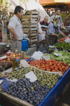 Turkey, Aydin Province, Kusadasi, Stall at weekly market  selling fresh fruit and vegetables in brightly coloured display.