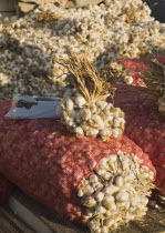 Turkey, Aydin Province, Kusadasi, Garlic for sale at weekly market.