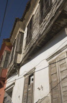 Turkey, Aydin Province, Kusadasi, Exterior facades of Ottoman era whitewashed plaster and wooden houses in the old town.