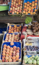 Turkey, Aydin Province, Sirince, Fruit stall selling fresh local peaches or Seftali in Turkish, plums and apples.