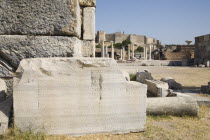 Turkey, Izmir Province, Selcuk, Ruins of the 6th century Basilica of St. John the Apostle with piece of inscribed stone and fallen masonry in foreground.