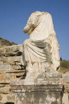 Turkey, Izmir Province, Selcuk, Ephesus, Headless statue on plinth in ancient city of Ephesus on the Aegean sea coast. 