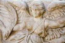 Turkey, Izmir Province, Selcuk, Ephesus, Detail of bas relief carving of the Goddess Nike on column in the  antique city of Ephesus on the Aegean sea coast.