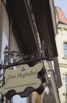 Austria, Vienna, Neubau District, Indian restaurant facade and hanging sign.