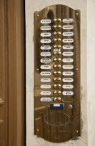 Austria, Vienna, Polished brass bell and names of residents at entrance to apartment.