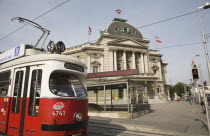 Austria, Vienna, Neubau District, Early model Wiener Linien Tram outside The Volkstheater with digital ticker sign displaying information above entrance to metro station.
