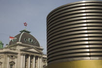 Austria, Vienna, Neubau District of Vienna, The Volkstheater.  Part view of exterior facade seen behind modern, circular structure.