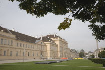 Austria, Vienna, Neubau District, MuseumsQuartier or the Museum Quarter, the former Imperial Stalls which were converted into a museum complex in the 1990s. Exterior and formal lawns part framed by tr...