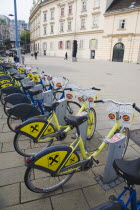 Austria, Vienna, Neubau District, Line of city bicycles for public use at the Museumsquartier or Museum Quarter, the former Imperial Stalls which were converted into a museum complex in the 1990s hous...