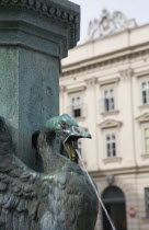 Austria, Vienna, Neubau District, Detail of bronze fountain with swan or goose with outstretched and water spouting from open beak.