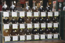 Austria, Vienna, The Naschmarkt, Display of Federweisser, wine in the fermentation stage, known as Sturm in Austria.  