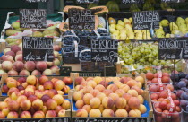 Austria, Vienna, The Naschmarkt, Display of fresh fruit for sale including peaches, nectarines, blueberries, plums and grapes.